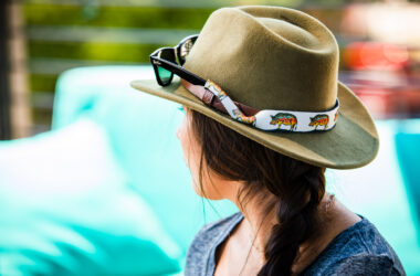 Woman wearing at hat with Croakies eyewear retainers